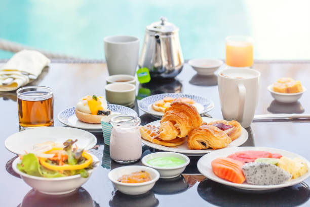 istock American Breakfast Set on Table Next to Poolside in Resort 1321525427