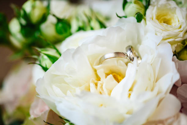istock Wedding rings on a wedding bouquet. 1321527072