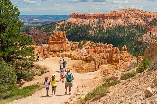 People hiking the Navajo Loop hike in Bryce Canyon during a summer trip, Bryce Canyon national park, Utah, USA.