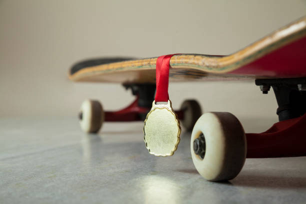 istock Skateboard with gold medal. 1321532312