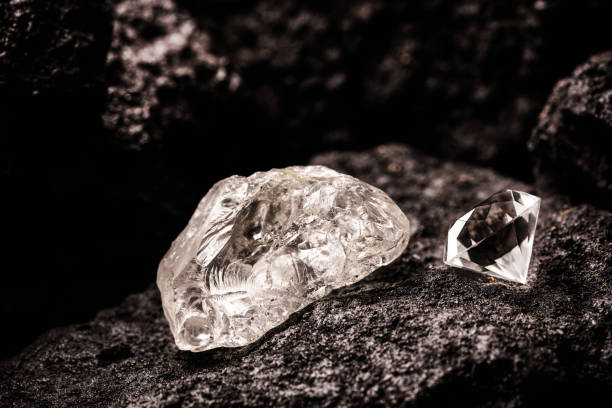istock rough diamond and cut diamond in coal mine, mining concept and rare gemstone 1321535526