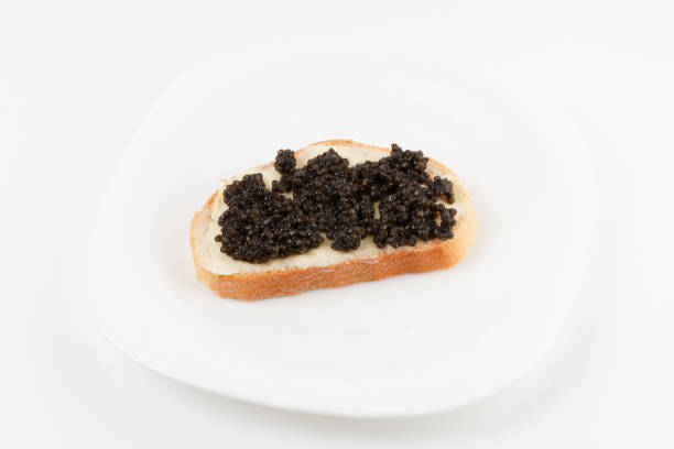 istock Real, not imitated, beluga caviar on plate, isolated 1321536915