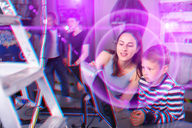 istock Young mother and preteen son using computer in quest room 1321539915