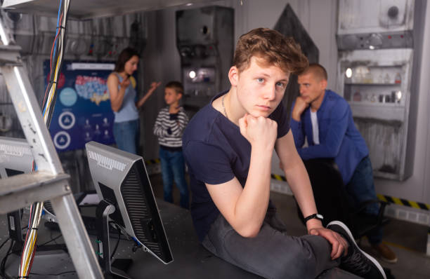 istock Brooding family tries to find a solution to a puzzle in a quest room 1321539926