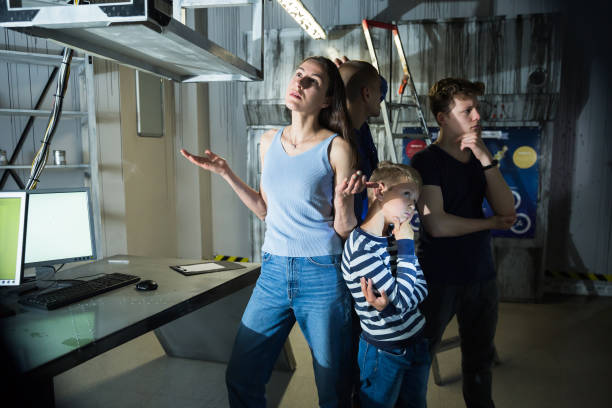istock Brooding family tries to find a solution to a puzzle in a quest room 1321540018