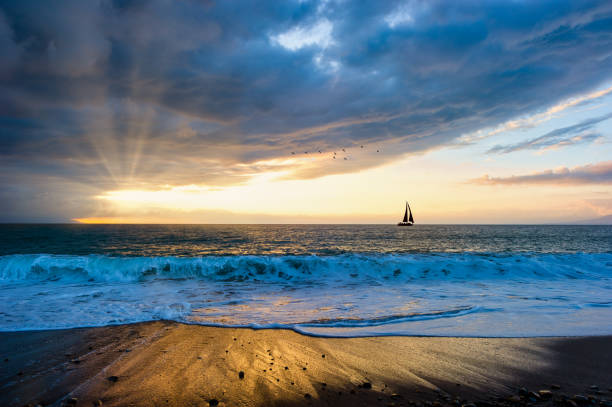 istock Sunset Sailboat Sun Ray Journey 1321540168