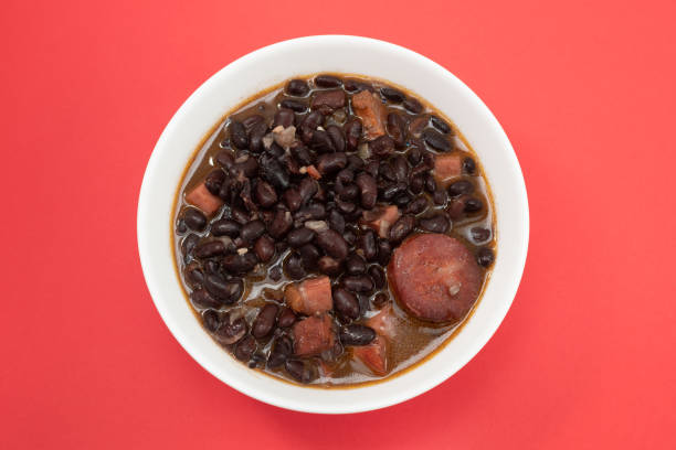istock black beans with meat and sausages in white bowl 1321542363