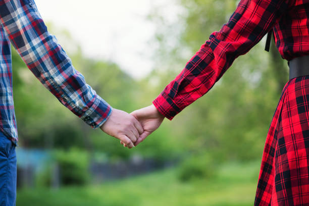 istock Unrecognizable hands couple in nature 1321545733