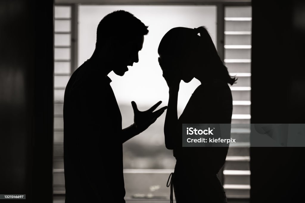 Argument. Man and woman having an argument at home. Breaking up. Arguing Stock Photo