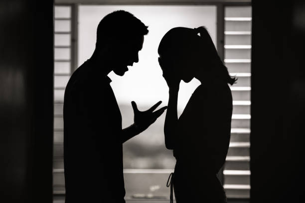 Argument. Man and woman having an argument at home. Breaking up. fighting stock pictures, royalty-free photos & images