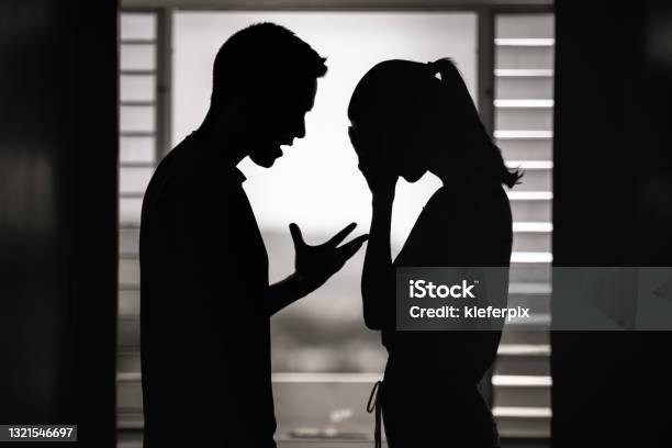 Argument Man And Woman Having An Argument At Home Stock Photo - Download Image Now