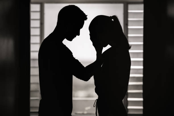 istock Man comforting his distraught wife at home 1321546887