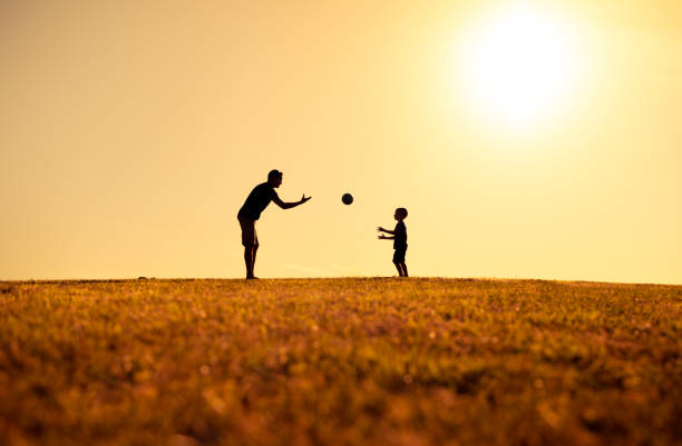 istock Father and his son playing in the park. 1321546908