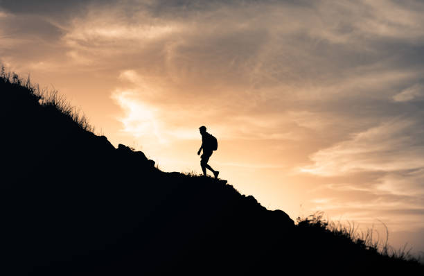 istock Male hiker at sunset. 1321547410
