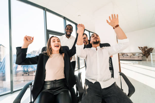 istock Multiracial office workers having fun together in office 1321548437