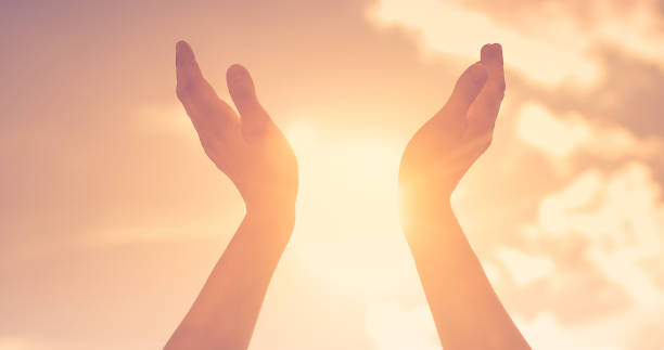 istock Woman praying. Hope, pray, love concept. 1321551528