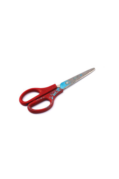 istock Red used scissors with paint splatter isolated on white background 1321559052