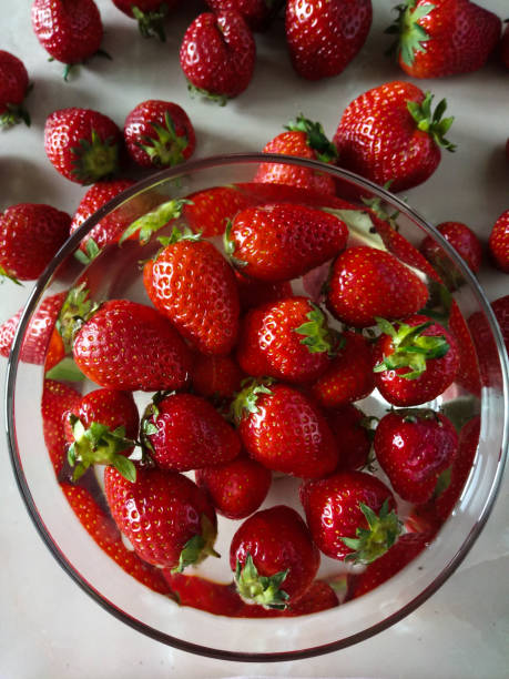 istock strawberries in a transparent plate on the kitchen table 1321560443