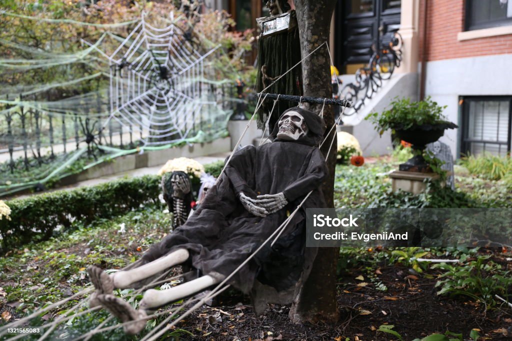 skeleton in a hammock. Halloween decorations outside Halloween Stock Photo