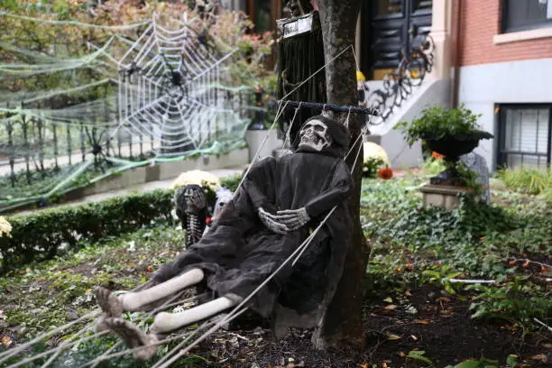 Photo of skeleton in a hammock.