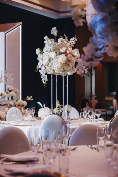 istock tableware Glasses, flower fork, knife served for dinner in restaurant with cozy interior 1321565593