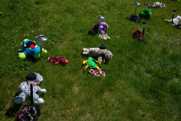 istock Mass memorial for victims found in mass grave 1321567476