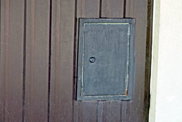 istock black metal box for electrical wires in a brown iron wall 1321573093