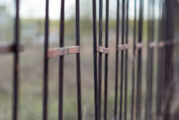 istock old rusty iron fence with a shallow depth of field 1321578345