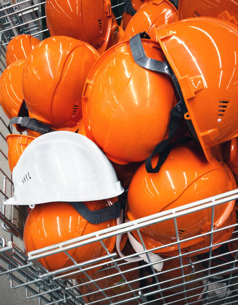 istock heap of construction hard hats (a mobile photo) 1321578690