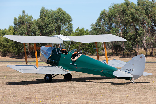Tyabb, Australia - March 9, 2014: De Havilland DH-82A Tigermoth vintage biplane VH-BVB taxiing at Tyabb Airport.