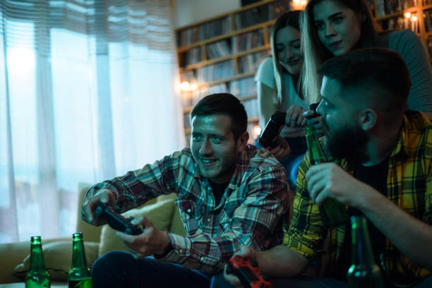 istock A group of friends playing video games while relaxing at home 1321580751