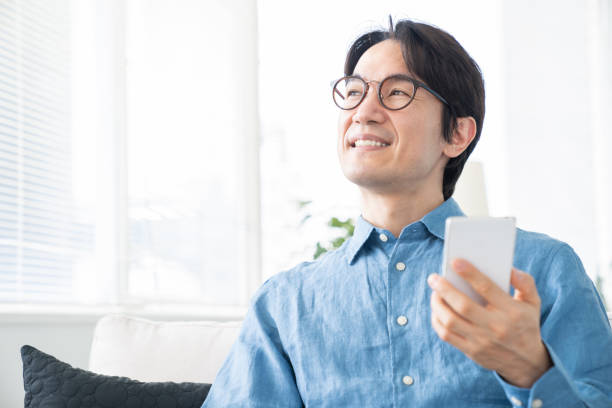 istock middle age man who uses smart phone 1321594906