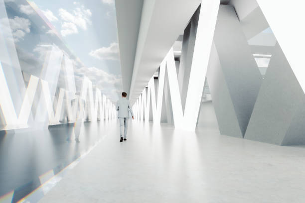 istock Businessman walking in big empty office building lobby 1321597948
