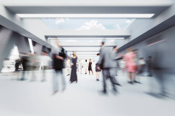 Business people talking in the office lobby lounge Business people talking in the office lobby lounge. 3D generated image. defocused office business motion stock pictures, royalty-free photos & images