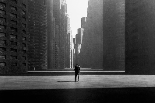 Lonely sad businessman in futuristic city. 3D generated image.