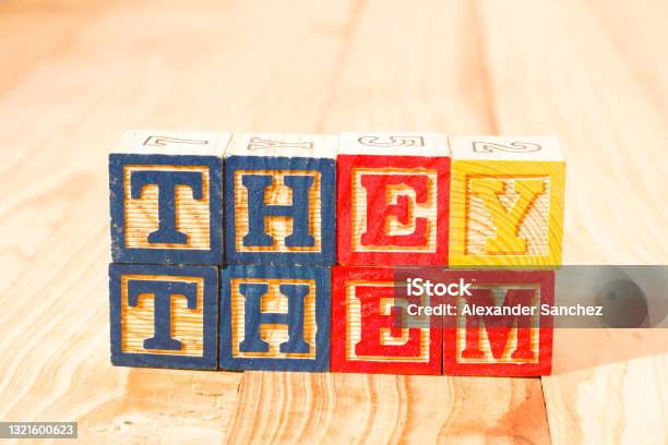 Spectacular Wooden Cubes With The Word They Them On A Wooden Surface Stock Photo - Download Image Now