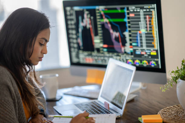 istock Middle Eastern woman working on business spreadsheets 1321602926
