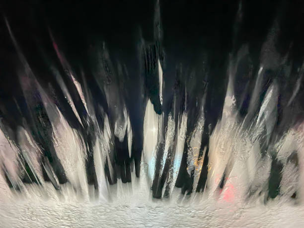 istock Abstract texture background view of a windshield in a car wash 1321604941