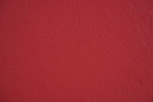 Rugged concrete texture. Red color. Background for designs