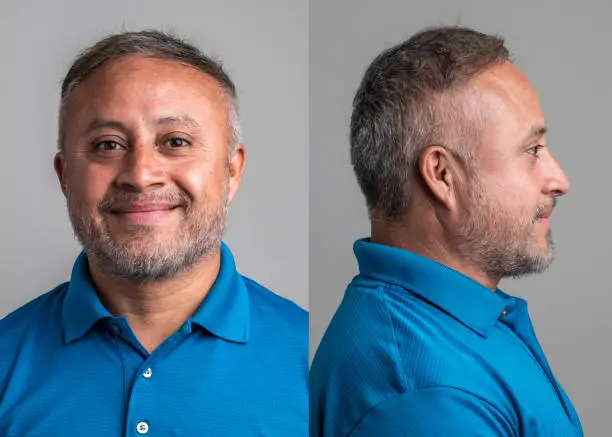 Smiling hispanic mature man front and profile mugshots on gray background