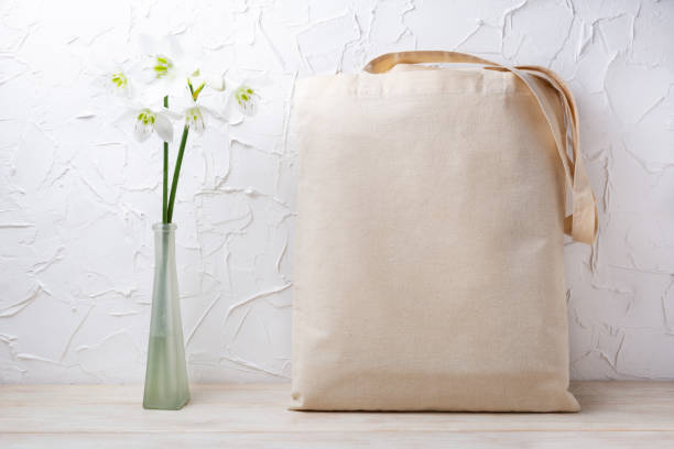 istock Rustic tote bag mockup with white lilies in the vase 1321612626
