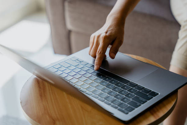 istock Asian woman using laptop at home 1321615843