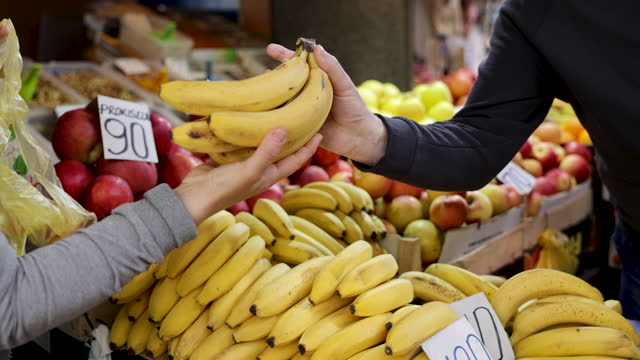 Picking bananas at the market