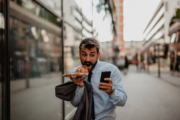 istock Hungry and busy businessman 1321619509
