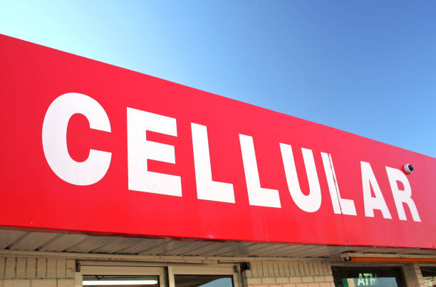 istock Red and White Cellular Phone Sign on Convenience Store 1321626400