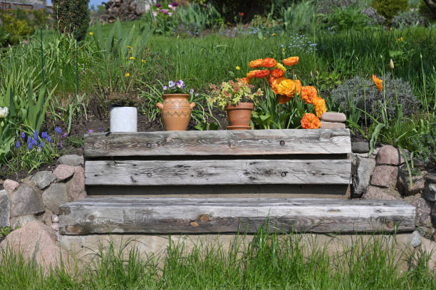 istock Wooden bench with flowers 1321627767