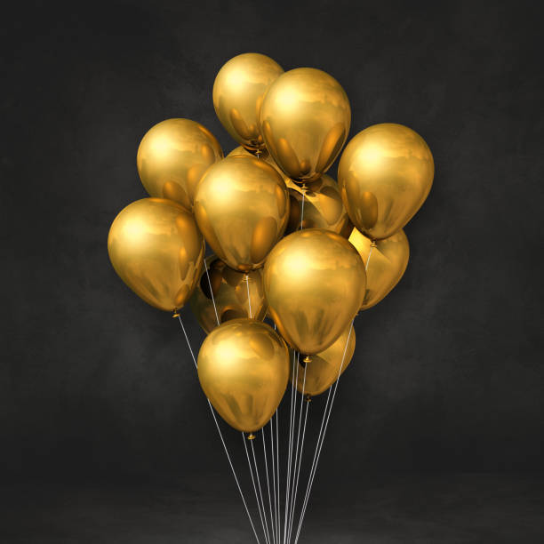 istock Gold balloons bunch on a black wall background 1321633092