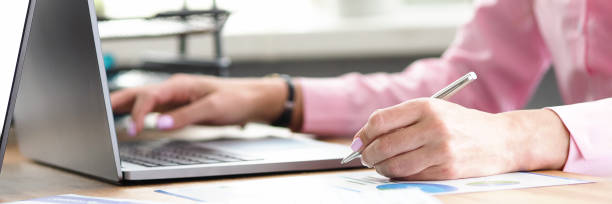 istock Office manager click on laptop keyboard close up 1321647681