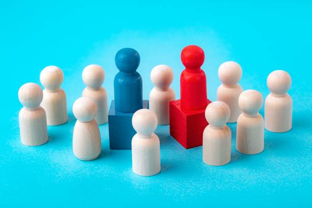 istock Negotiation concept. Business negotiations, diplomatic negotiations, candidate debates, conflicts and compromises. Two sets of dolls. 1321647863