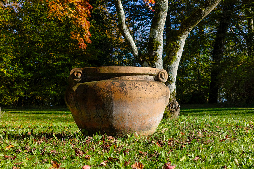 Old terracotta vase in the Palace Park Höhenried, Lake Starnberg, Bavaria, Germany